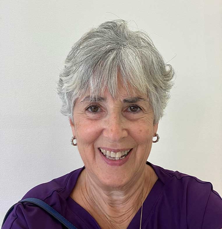 Portrait of a smiling woman with short, gray hair